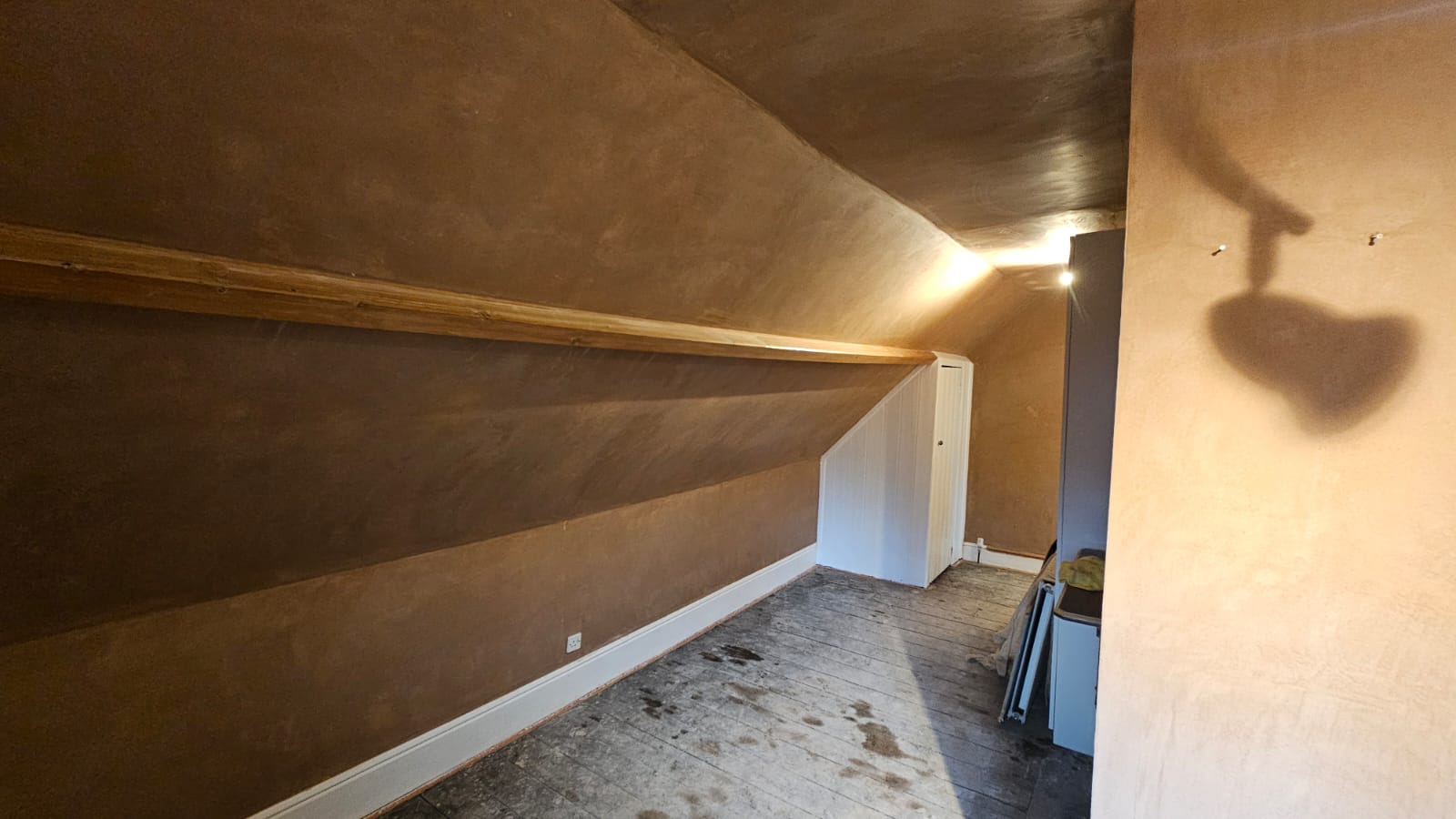 Completed loft bedroom re-skimmed in fresh pink plaster