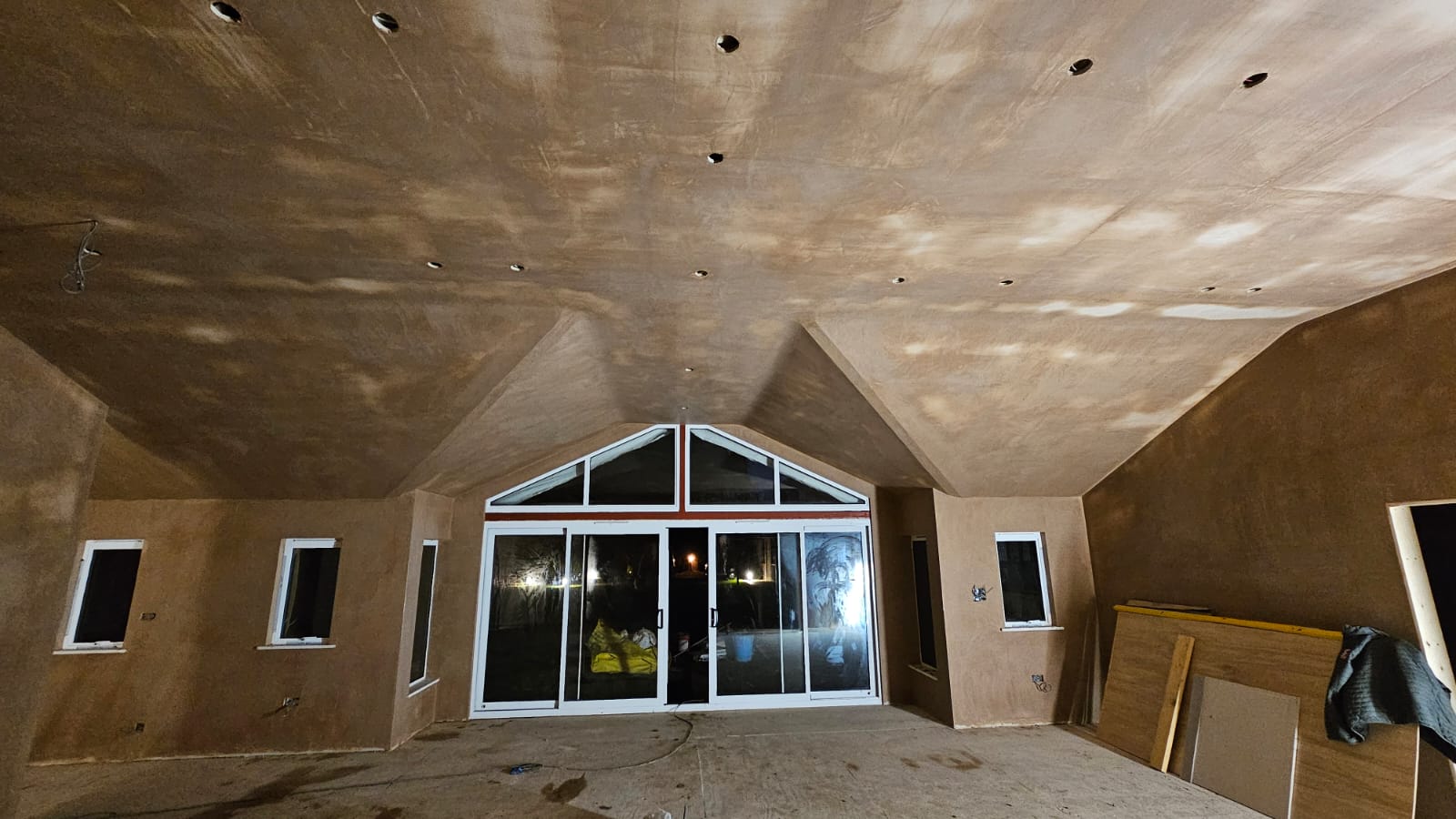 Cathedral-ceiling rear extension with multiple skylights, mid-build