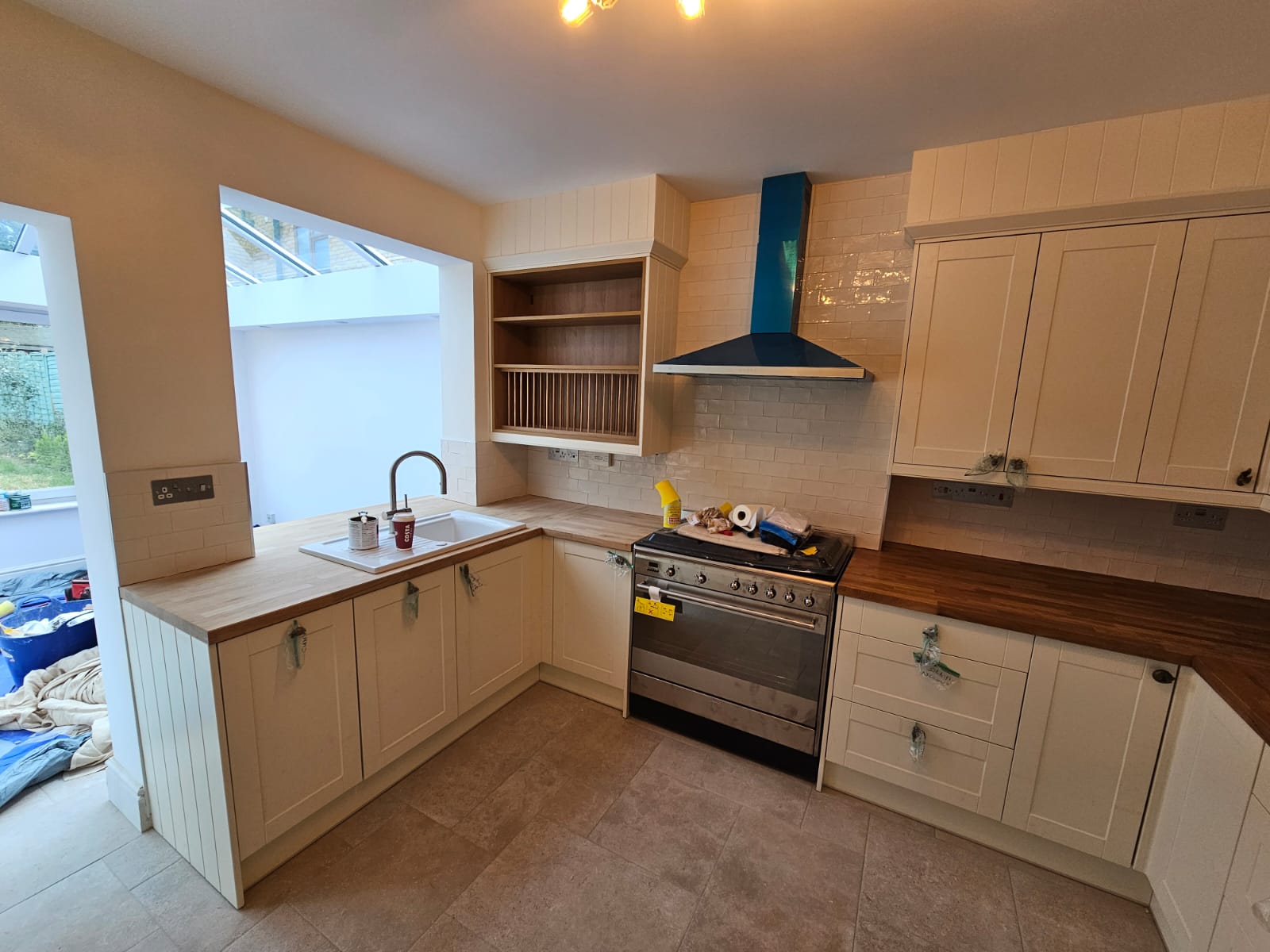 Newly fitted shaker kitchen with range cooker and pantry